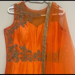 Orange color gown with jari work